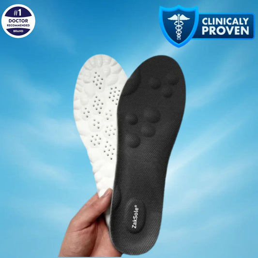 Black and white shoe insole held by a hand with 'Zaksole'
